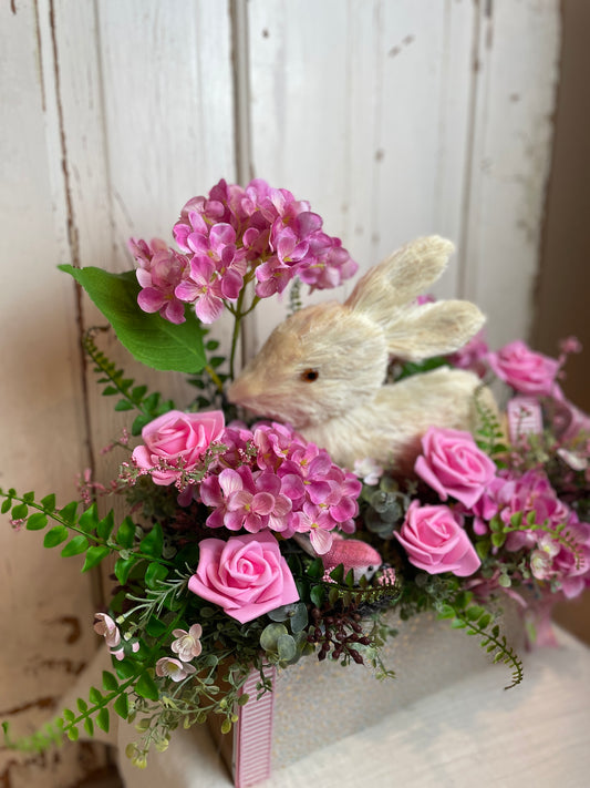 Charming bunny floral centerpiece with pink hydrangeas, foam roses, and soft greenery, ready to display, perfect for cottage and shabby chic decor.