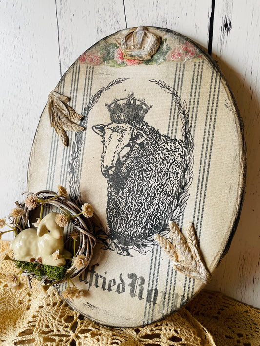 French Country wall decor mixed media assemblage with decoupage paper , a ceramic lamb, and a french market sheep with a crown