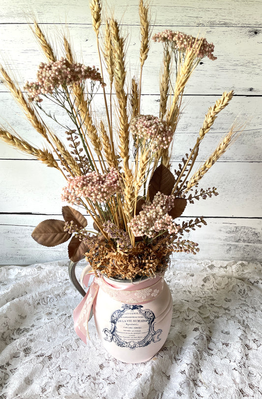 Dried floral arrangement in vintage pitcher