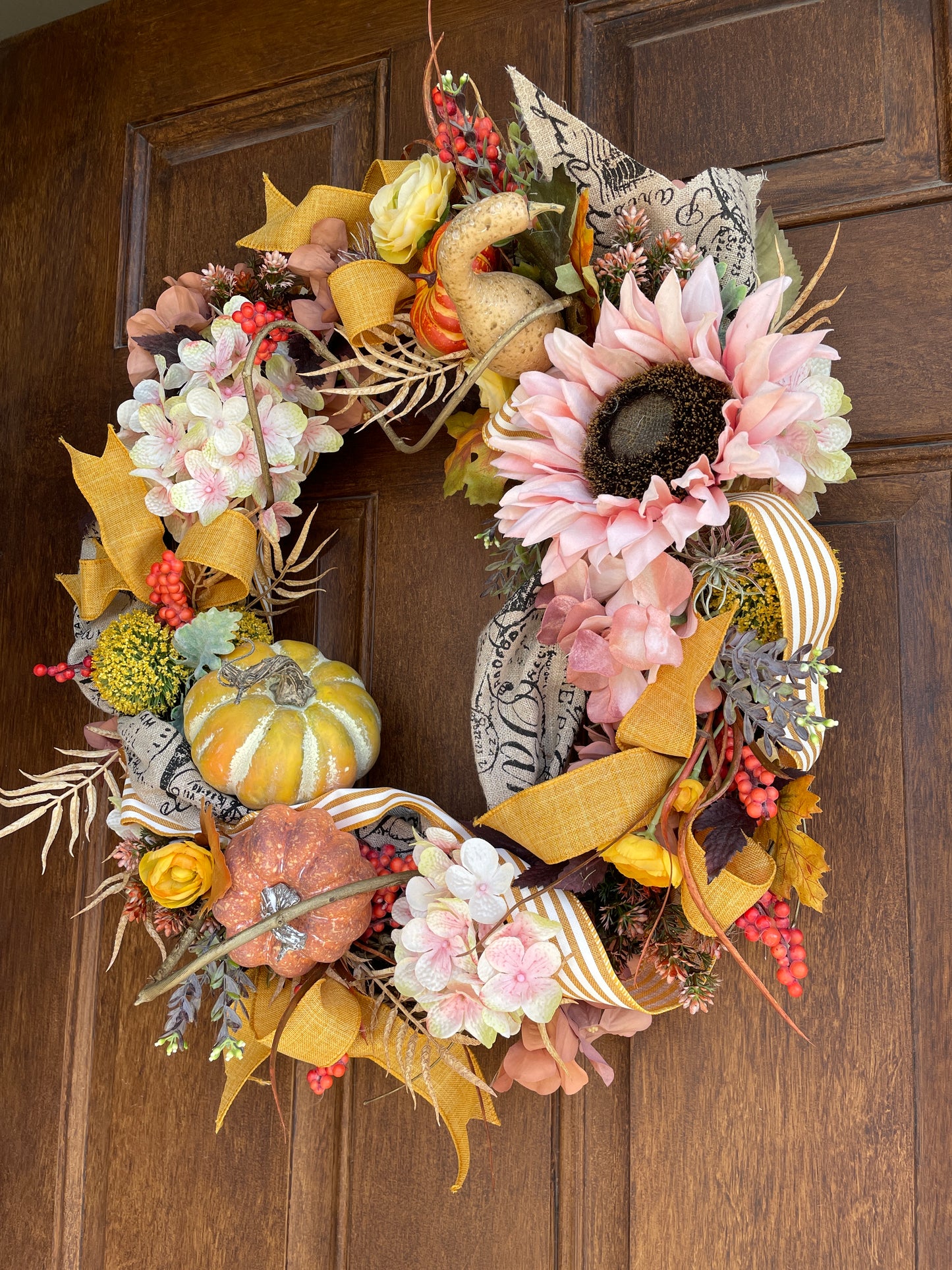 Fall door wreath with sunflowers and pumpkins