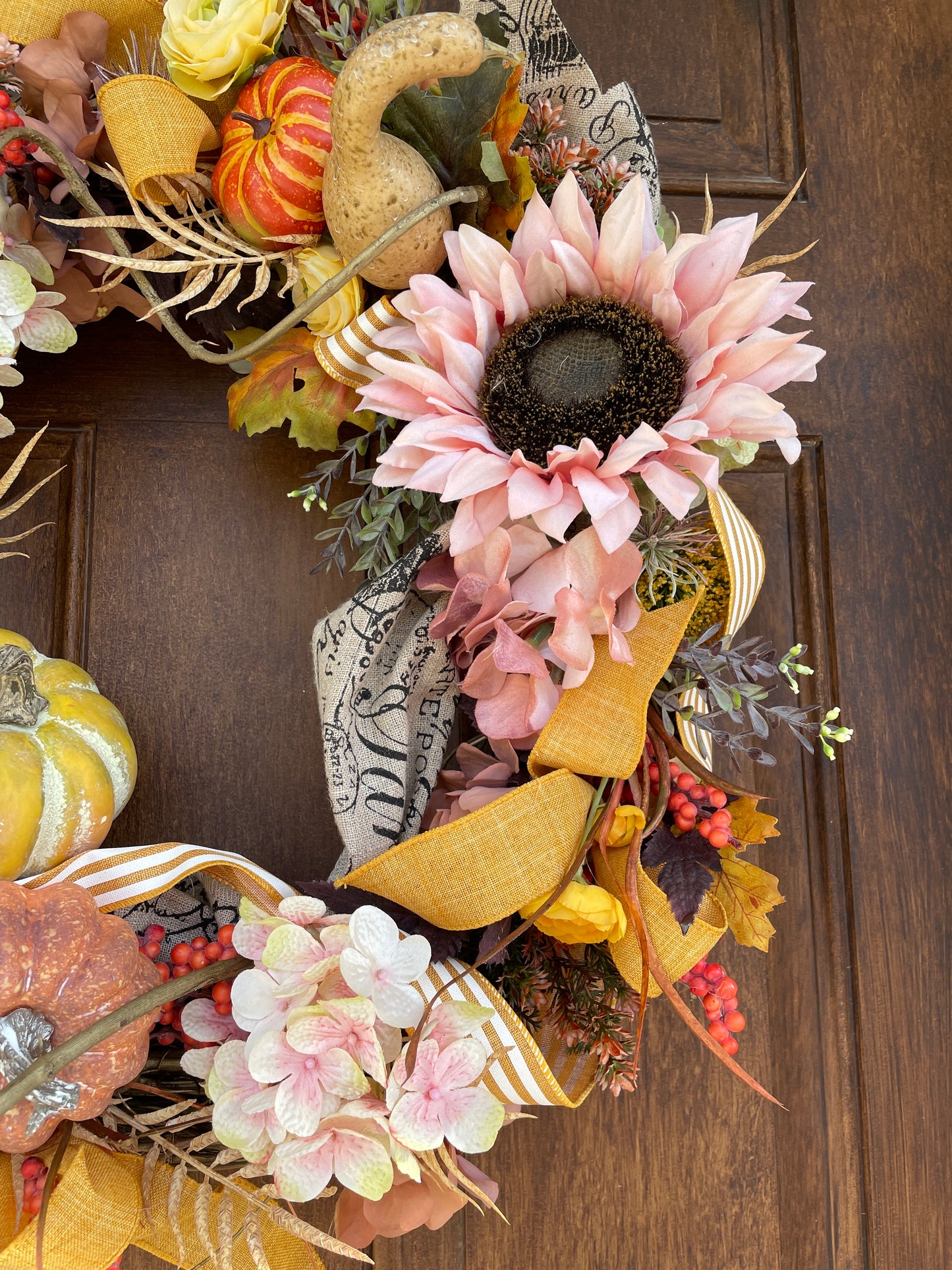 Fall door wreath with sunflowers and pumpkins