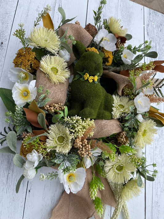 large floral wreath for indoor decor, with large moss covered bunny and white poppies with burlap ribbon