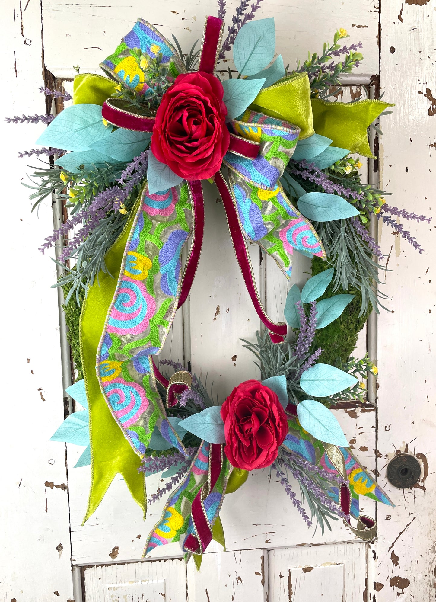 Colorful floral wreath with tapestry ribbon