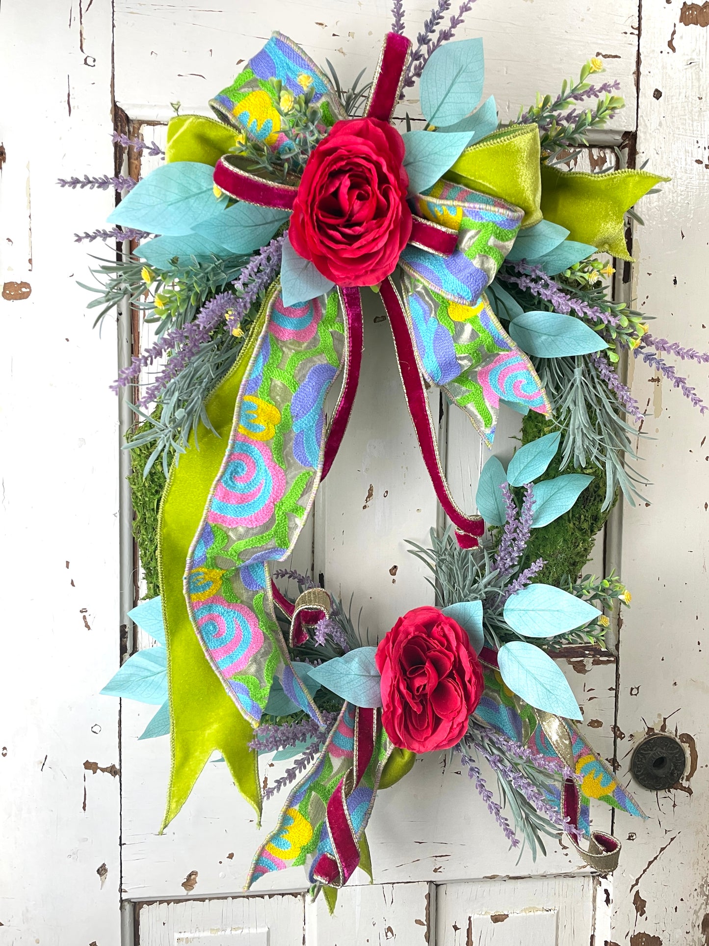 Colorful floral wreath with tapestry ribbon
