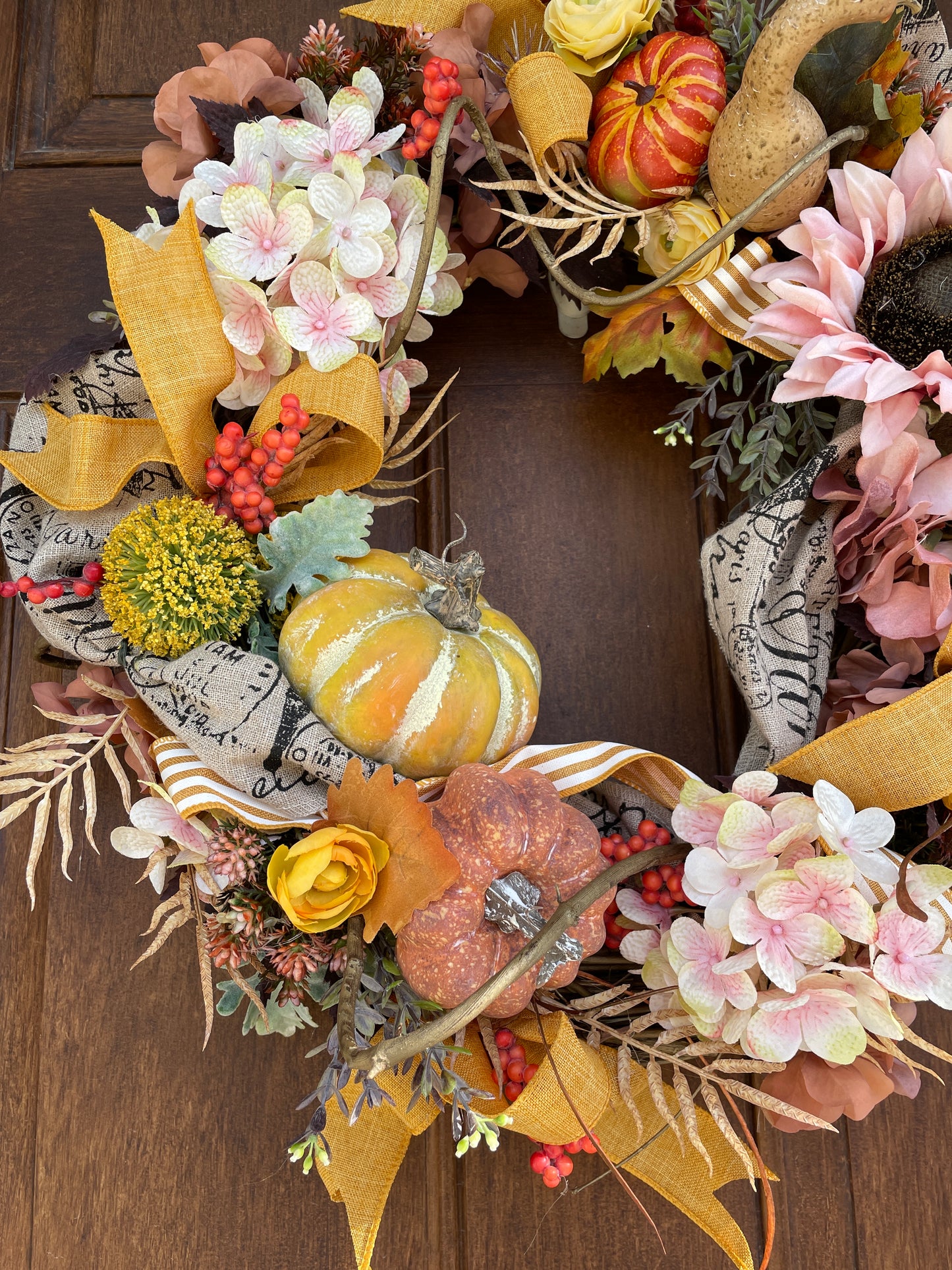 Fall door wreath with sunflowers and pumpkins