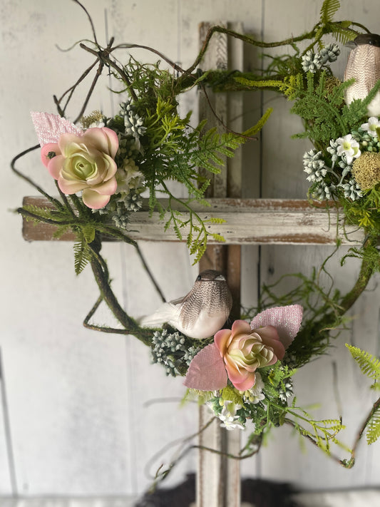 Wooden cross wall hanging with realistic faux succulents and vines, displayed against a light cottage-style background – ideal for sympathy gift or rustic home décor.