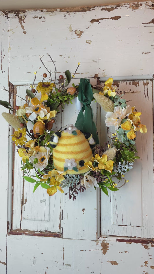 Beehive Cottage wreath featuring faux florals, soft greenery, and rustic accents in a handcrafted design—perfect for cottagecore, farmhouse, and vintage-inspired home decor