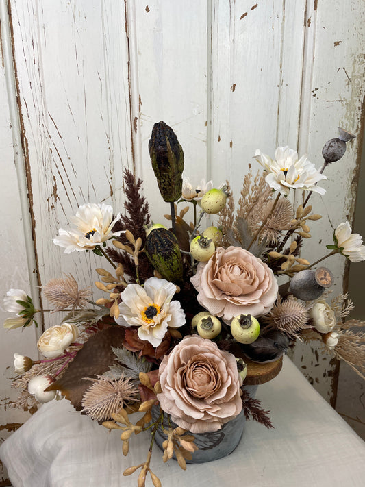 Boho style Wedding table centerpiece with blush roses, natural floral pods, and faux pampas grasses