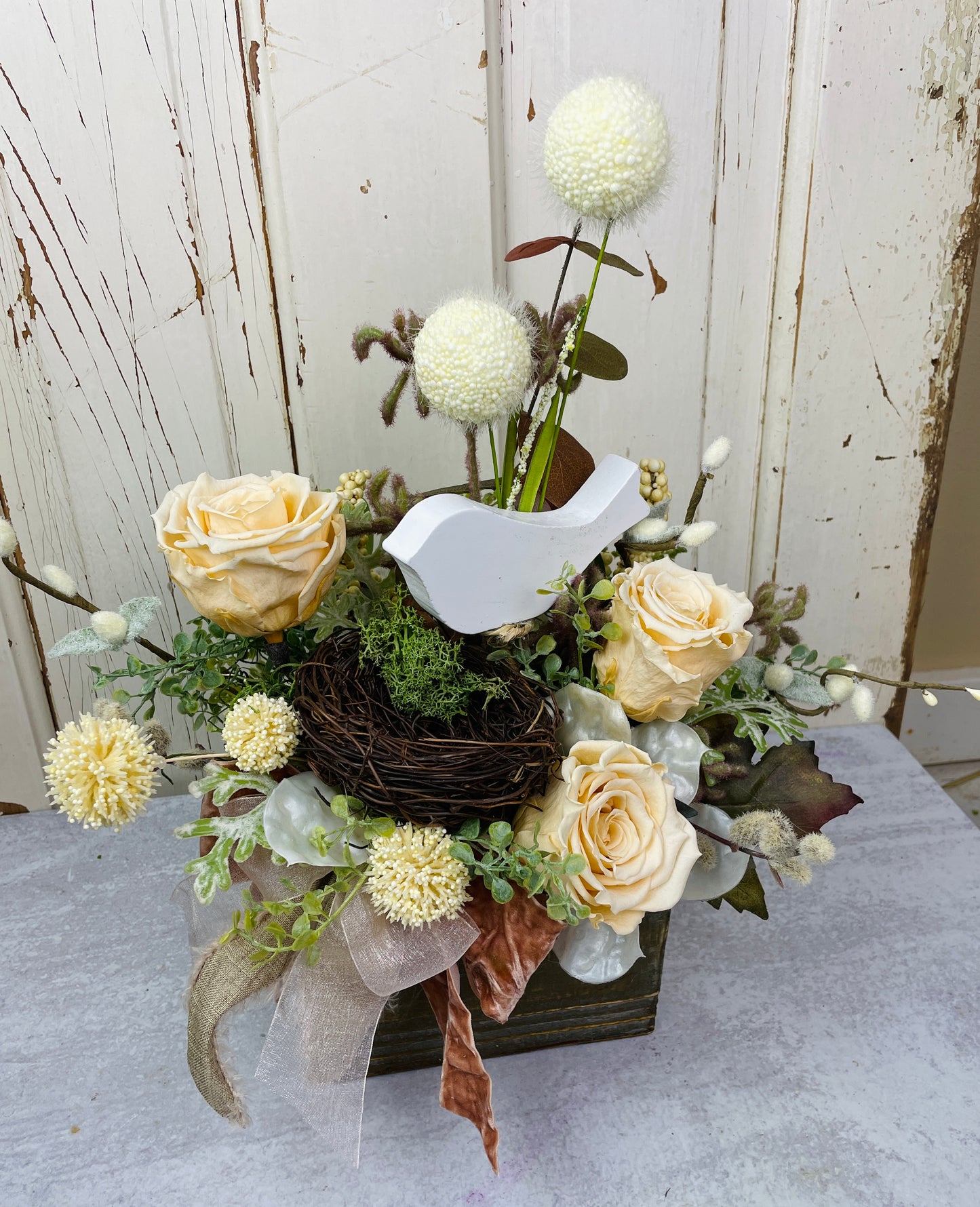Cottage decor style preserved roses and rids nest floral arrangemnet in a wooden box with velvet ribbons 