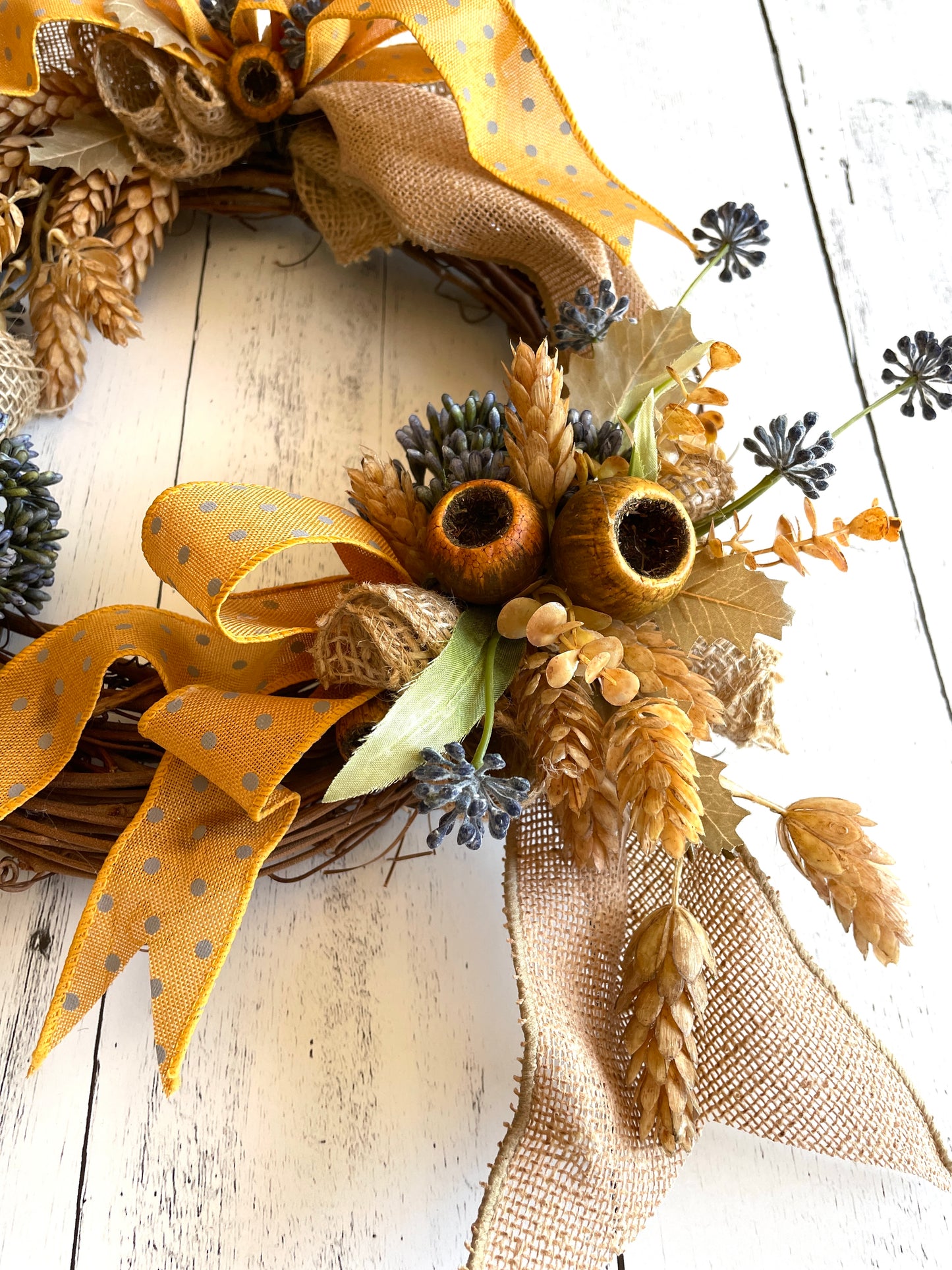 Rustic floral wreath with burlap and pods