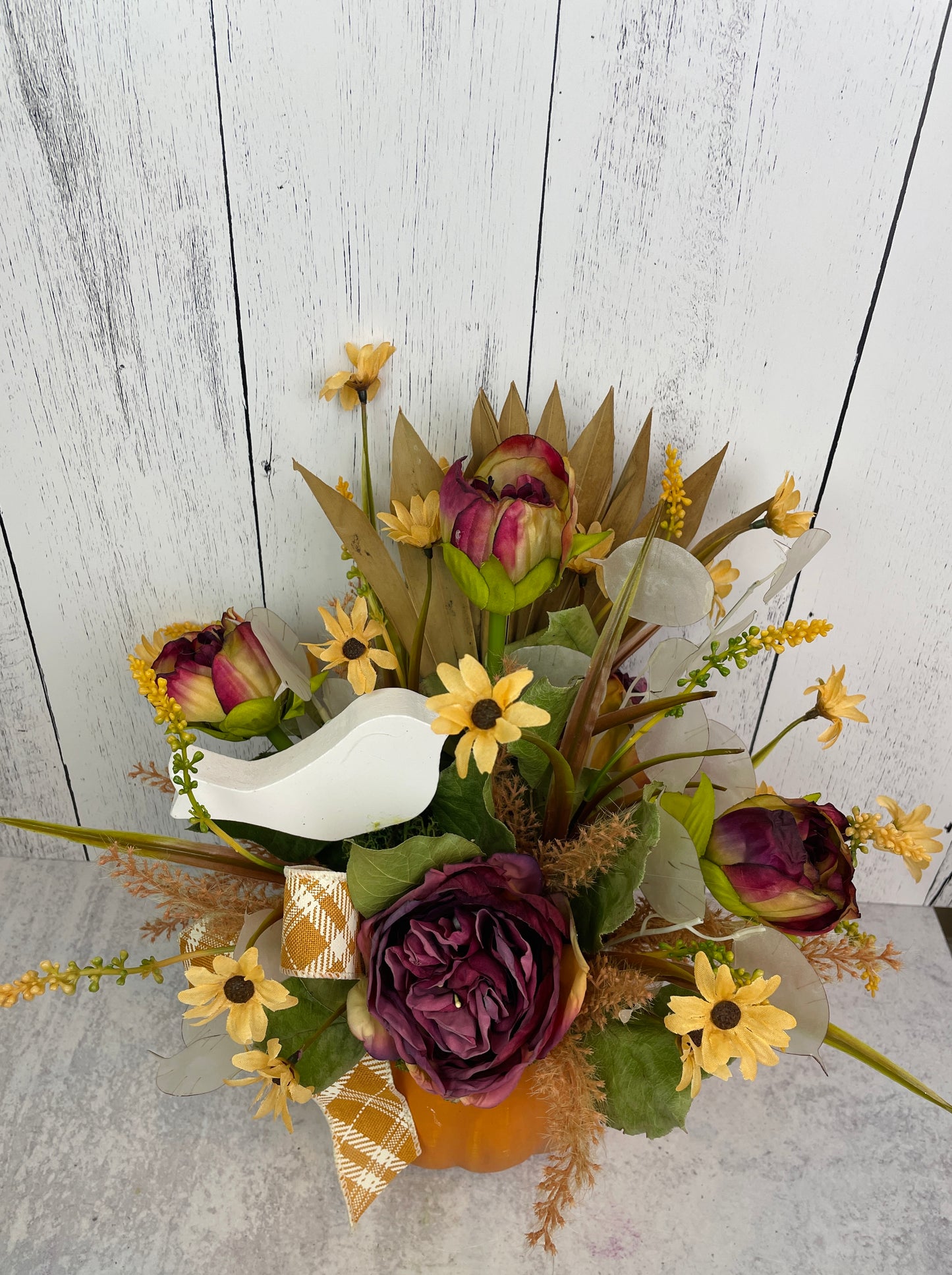 Fall Floral Arrangement in Pumpkin Container with Palm Leaves