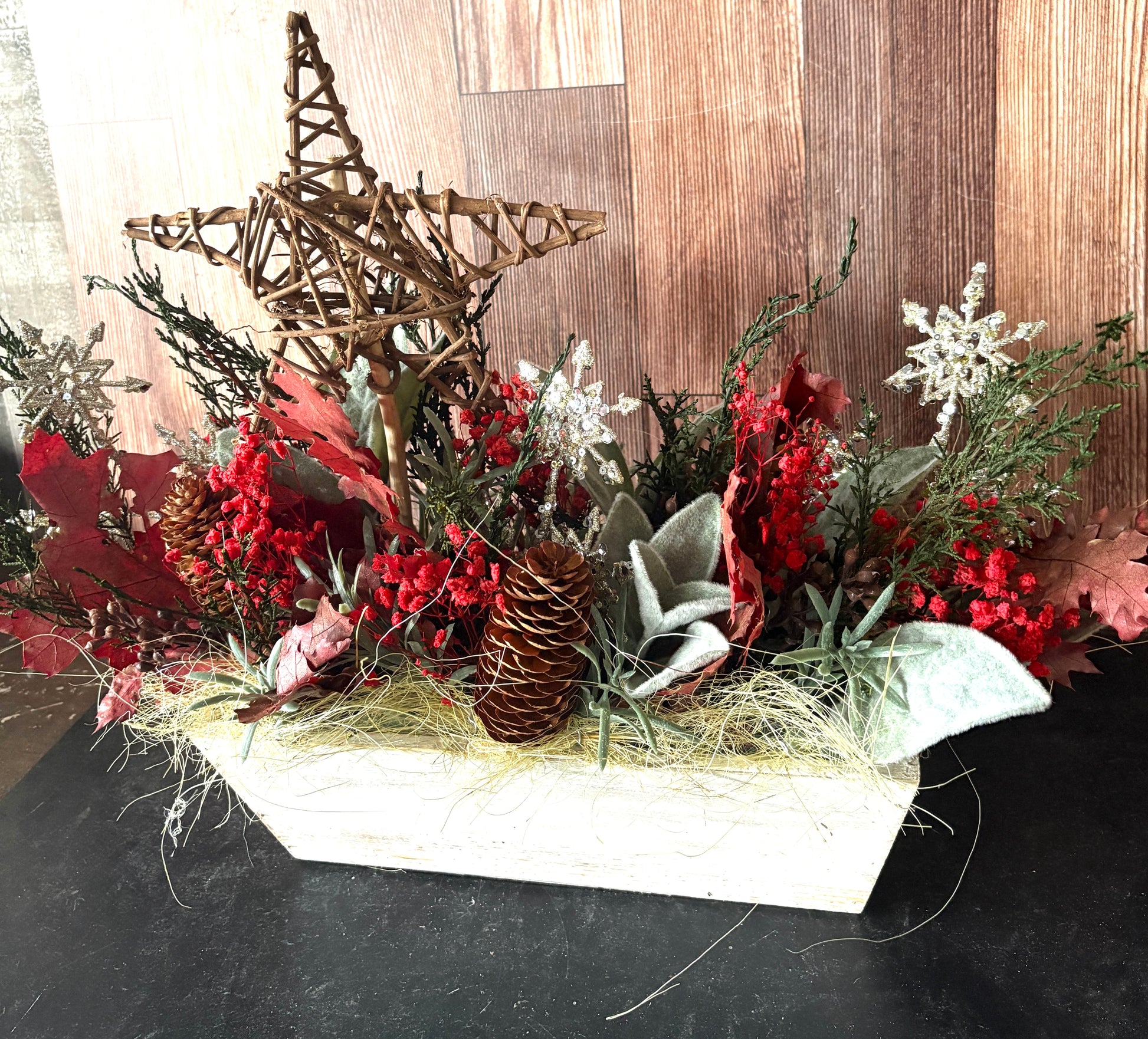 Preserved floral arrangement with wooden star and white snowflakes with pinecones, for a perfect christmas centerpiece or table accent 