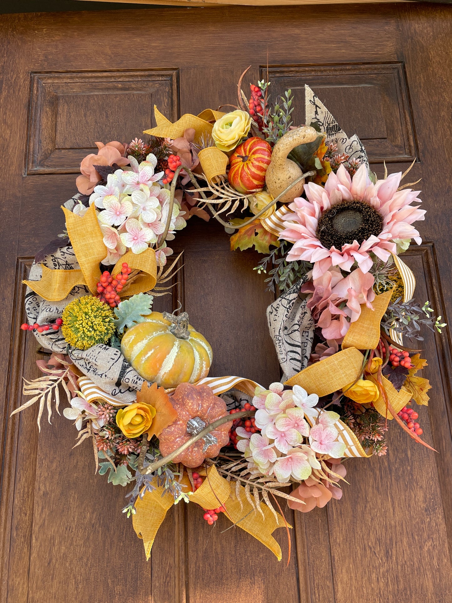 Fall door wreath with sunflowers and pumpkins