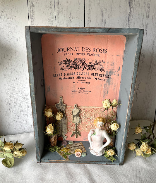 french style assemblage wall art with dried flowers and a vintage porcelain doll top
