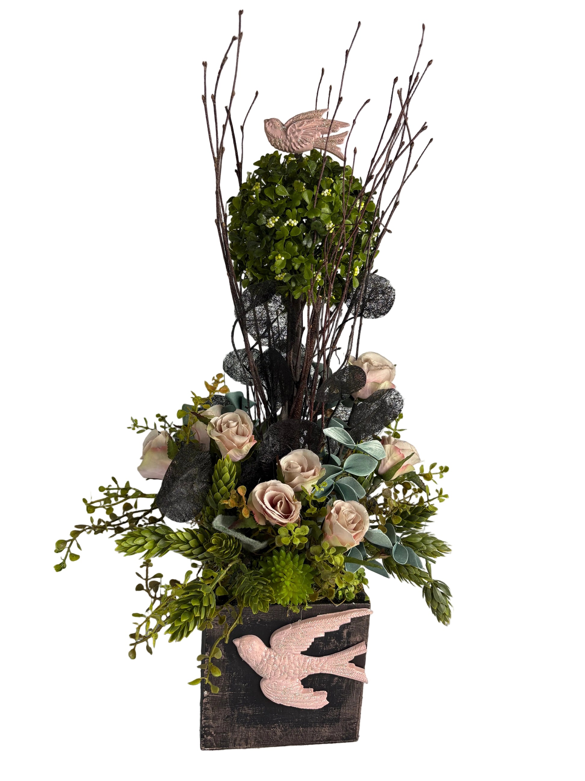 Bouquet of flowers with decorative elements in a wooden box with a bird featured , in romantic colors of blush pink and black 

